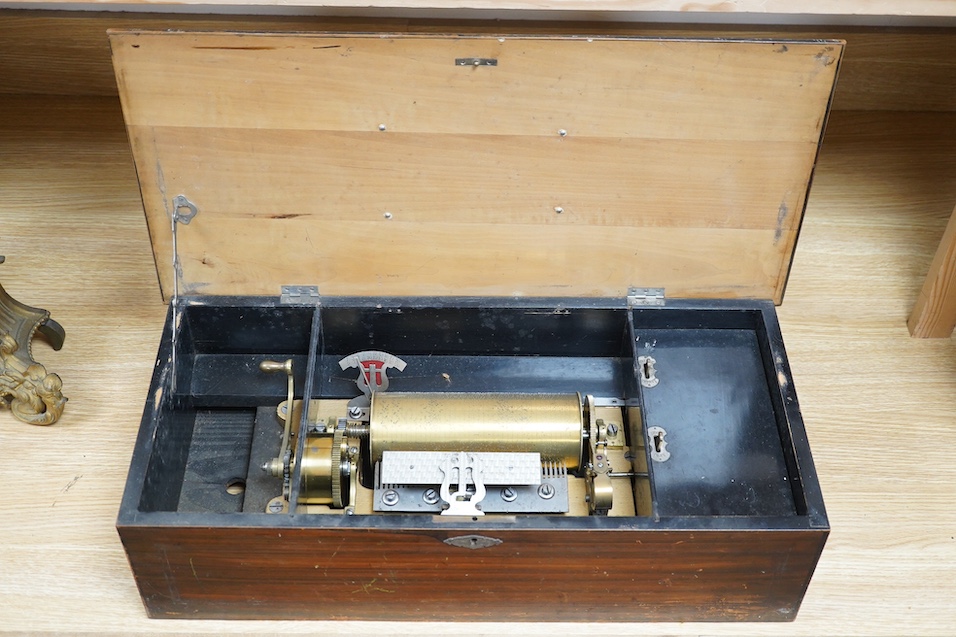 A 19th century Swiss cylinder music box, 58cm wide. Condition - fair to good, considerable wear to case